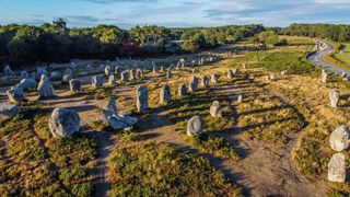 Aerial view of the Carnac stone alignments of Kermario in Morbihan, France - Prehistoric menhirs and megaliths in rows in Brittany