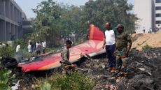 People pore over the crash site of Air India Flight 171 in Ahmedabad, India, on June 12, 2025.