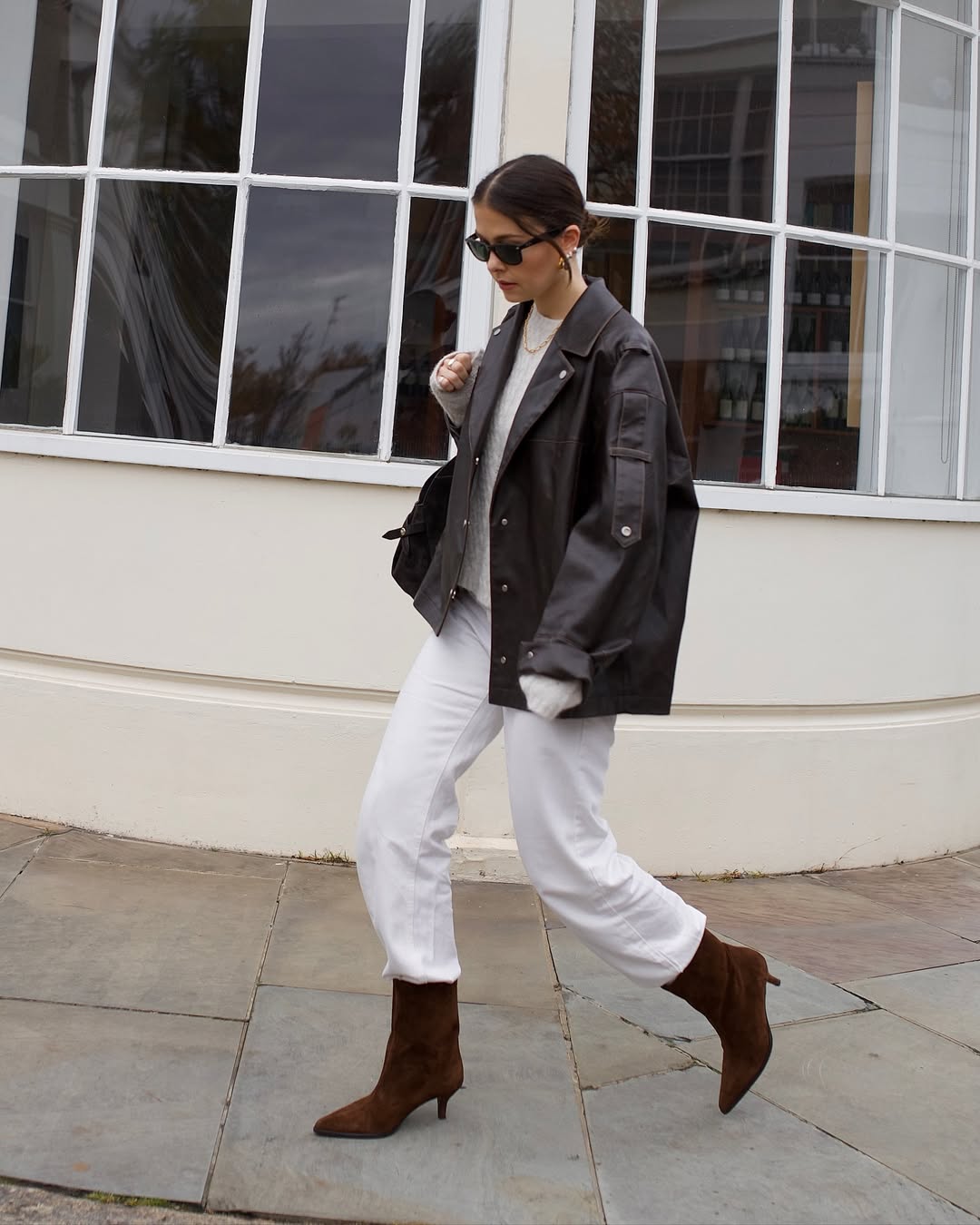 Alice Satterthwaite wears a white jeans outfit.