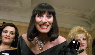The Witches Anjelica Houston grins evilly in the ballroom