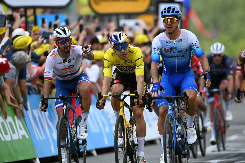 SONDERBORG DENMARK JULY 03 Dylan Groenewegen of Netherlands and Team BikeExchange Jayco celebrates at finish line as stage winner ahead of Peter Sagan of Slovakia and Team Total Energies and Wout Van Aert of Belgium and Team Jumbo Visma Yellow Leader Jersey during the 109th Tour de France 2022 Stage 3 a 182km stage from Vejle to Snderborg TDF2022 WorldTour on July 03 2022 in Sonderborg Denmark Photo by Stuart FranklinGetty Images