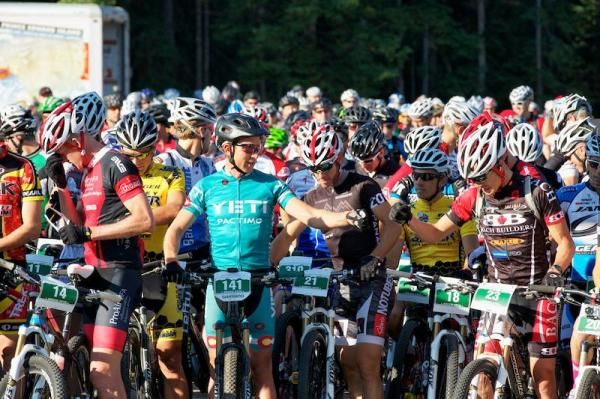 Yeti Pactimo XC rider Nick Truitt and Bach Builders rider Josh Tostado fist bump at start.