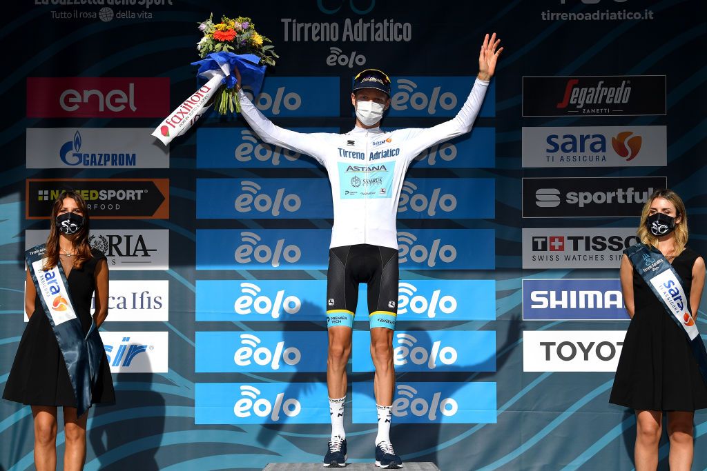 SARNANO ITALY SEPTEMBER 11Podium Aleksandr Vlasov of Russia and Astana Pro Team White Best Young Jersey Celebration Mask Covid safety measures Flowers during the 55th TirrenoAdriatico 2020 Stage 5 a 202km stage from Norcia to SarnanoSassotetto 1335m TirrenAdriatico on September 11 2020 in Sarnano Italy Photo by Justin SetterfieldGetty Images