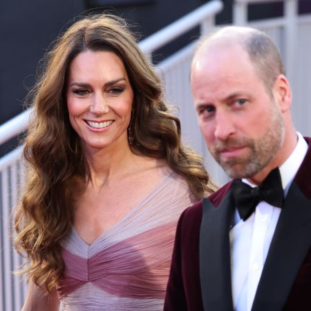 Princess Kate wears a pink gown to attend the BAFTAs 2026 with husband Prince William who has a bald head, a beard, and is wearing a burgundy velvet jacket