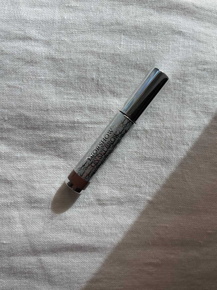 The xx brow gel on a white linen background