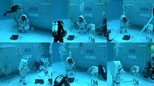 Astronauts in weighted spacesuits participate in the European Space Agency's "Moondive" study in a 33-foot-deep (10 meters) pool.