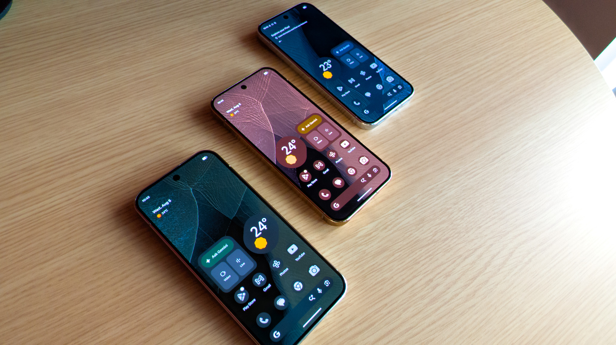 The themed home screens of each color Google Pixel 11 Pro (green, blue, pink)