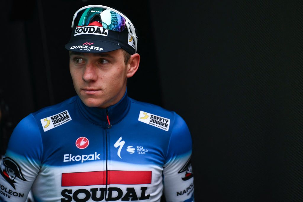 Soudal Quick-Step team&#039;s Belgian rider Remco Evenepoel looks on at the podium area after placing second in the 118th edition of the Giro di Lombardia (Tour of Lombardy), a 252km cycling race from Bergamo to Como on October 12, 2024. (Photo by Marco BERTORELLO / AFP)