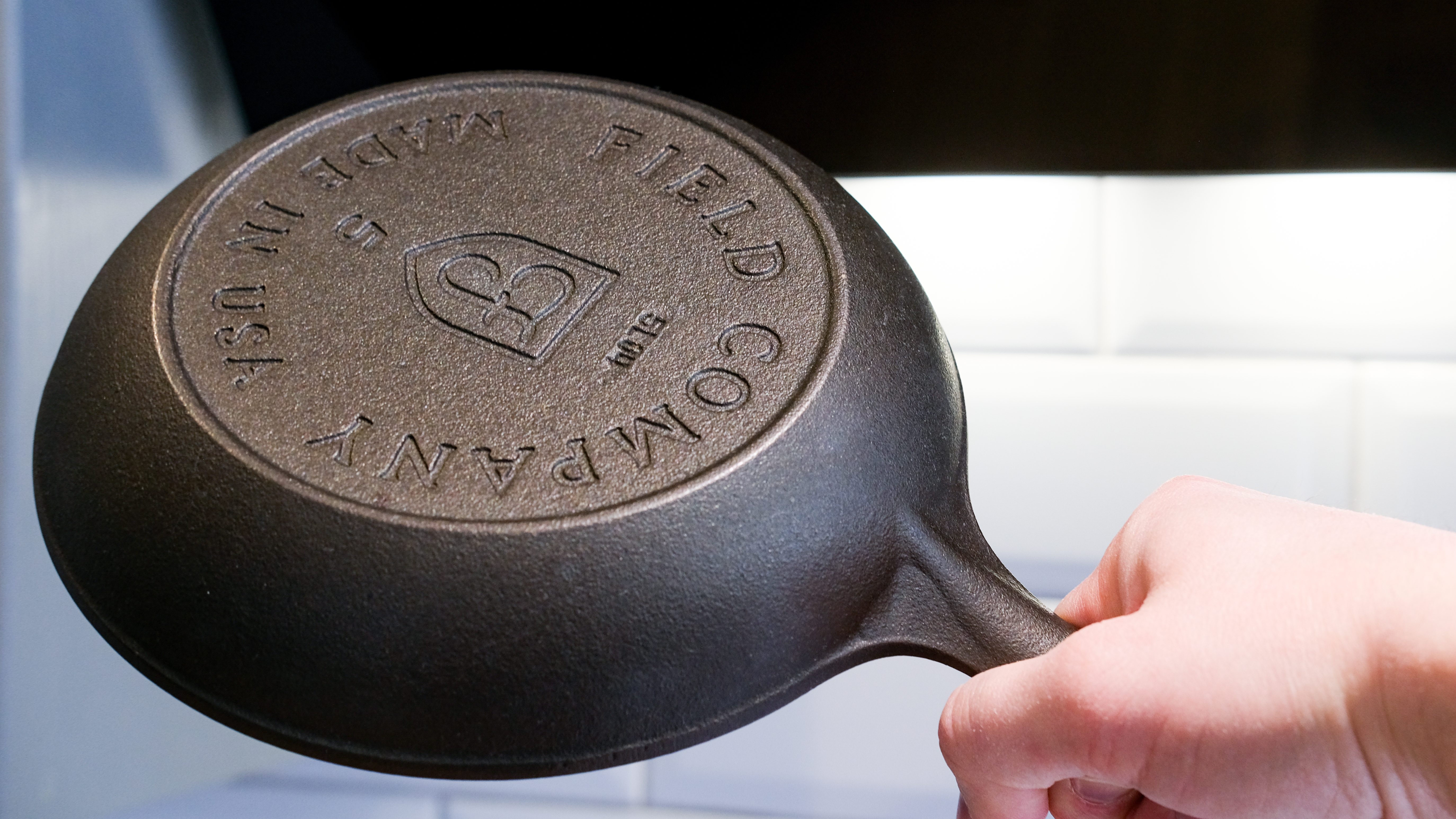 The Field Company Skillet in hand