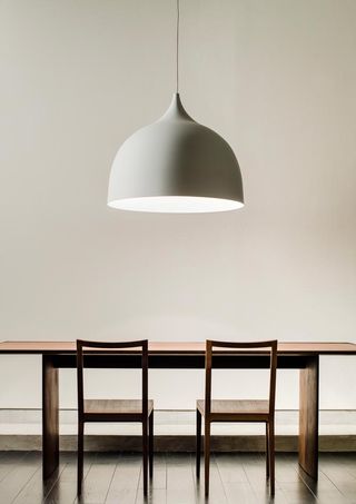 ’Bisque’ pendant light, ’Antonio’ chairs’, and ’Lotus’ dining table, all by Time & Style