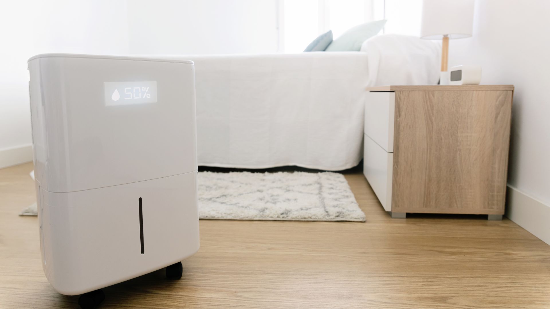 picture of dehumidifier in a bedroom with neutral decor