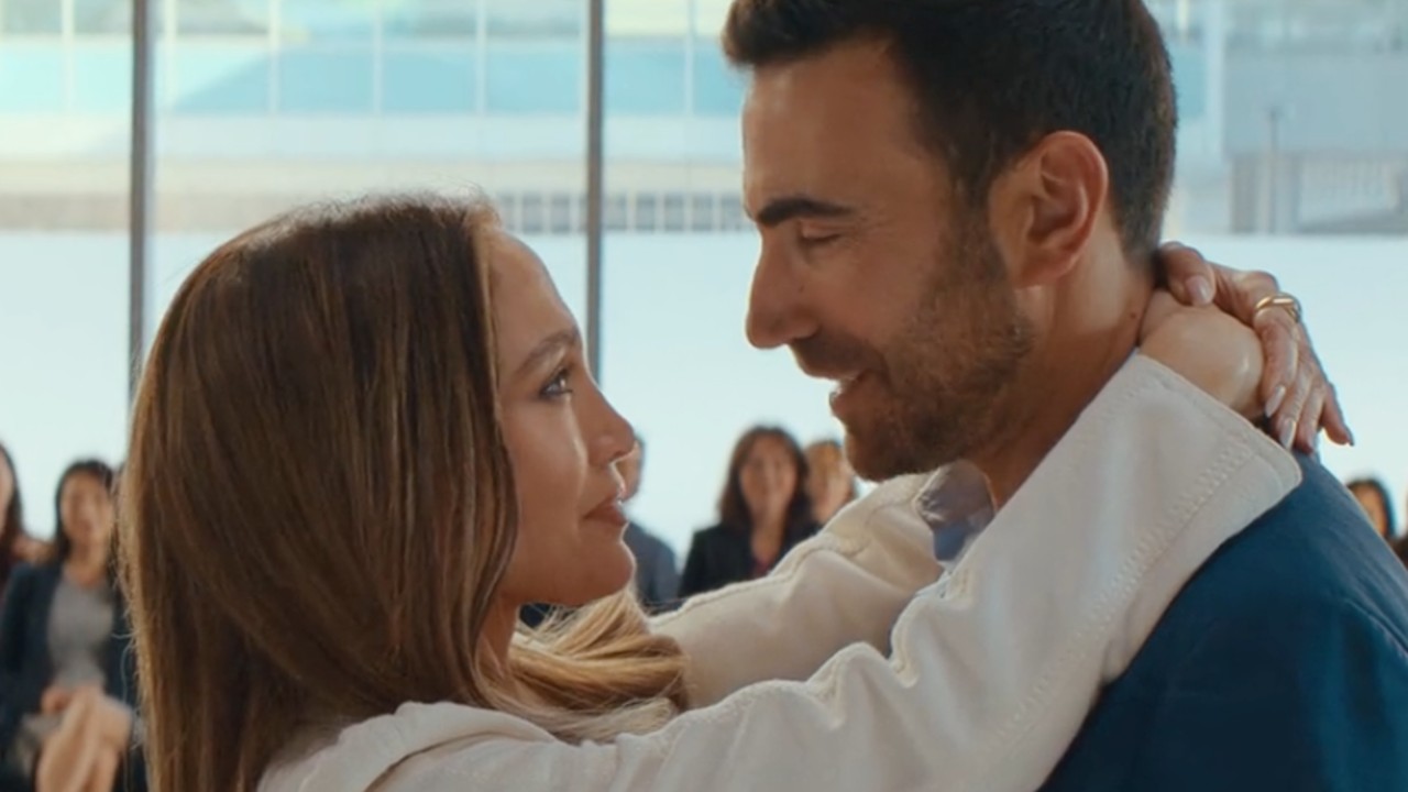 Brett Goldstein looking into Jennifer Lopez's eyes in Office Romance.