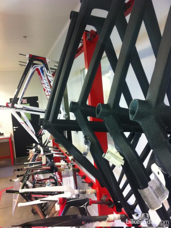 Raw frames are hung with a selection of others that are being refinished or updated