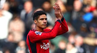 LONDON, ENGLAND - NOVEMBER 04: Raphael Varane of Manchester United applauds the fans following the team's victory during the Premier League match between Fulham FC and Manchester United at Craven Cottage on November 04, 2023 in London, England. (Photo by Bryn Lennon/Getty Images)