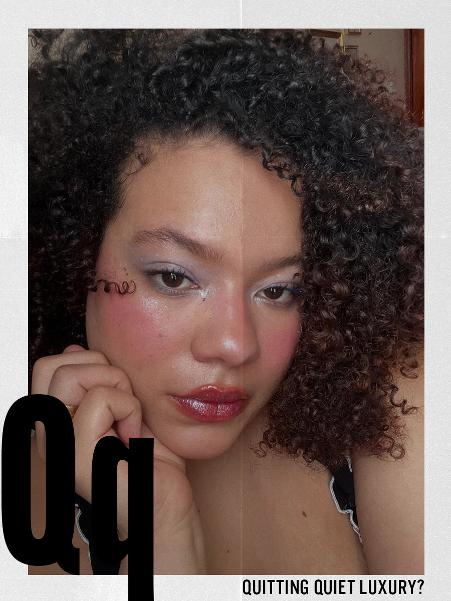 A woman taking a selfie with a colourful makeup look