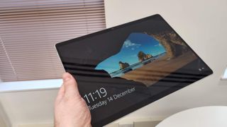 Surface Pro 8, one of the best tablets for students being held