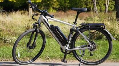 Juiced CrossCurrent X review: Pictured here, the bike parked on a the pavement