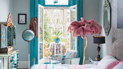 Bedroom with adjoining balcony garden and a plant on the table 