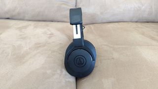 The Audio-Technica ATH-M20xBT resting on a couch