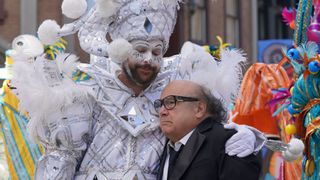 Charlie in parade clown costume hugging Frank in It's Always Sunny in Philadelphia Season 18
