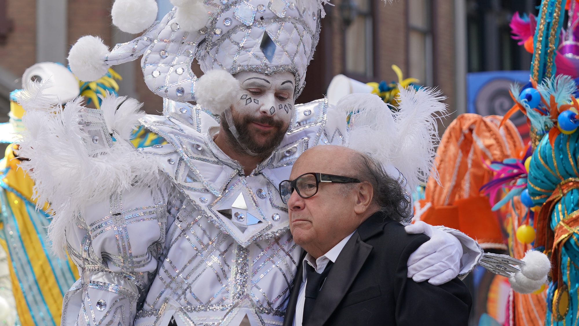 Charlie in parade clown costume hugging Frank in It's Always Sunny in Philadelphia Season 18
