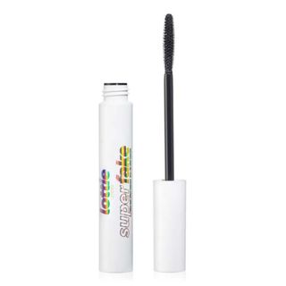 An opened white mascara tube from Lottie London on a white background,