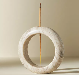 Anthropologie marble ring-shaped incense holder.