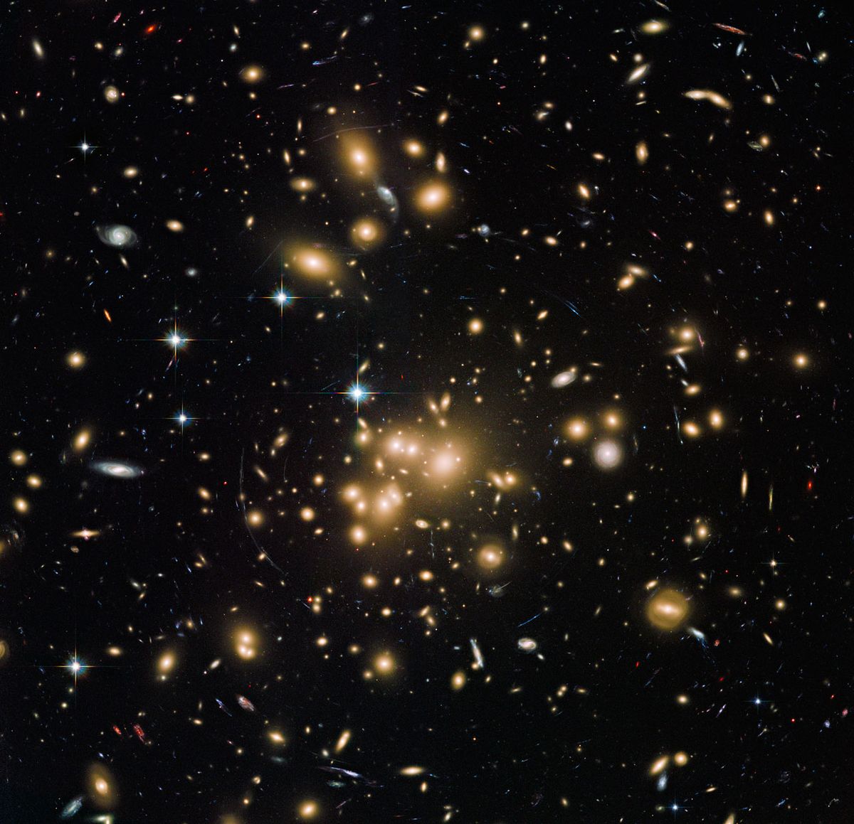 This Hubble image shows galaxy cluster Abell 1689. It combines both visible and infrared data from Hubble’s Advanced Camera for Surveys (ACS) with a combined exposure time of over 34 hours to reveal this patch of sky in greater and more striking detail than in previous observations.