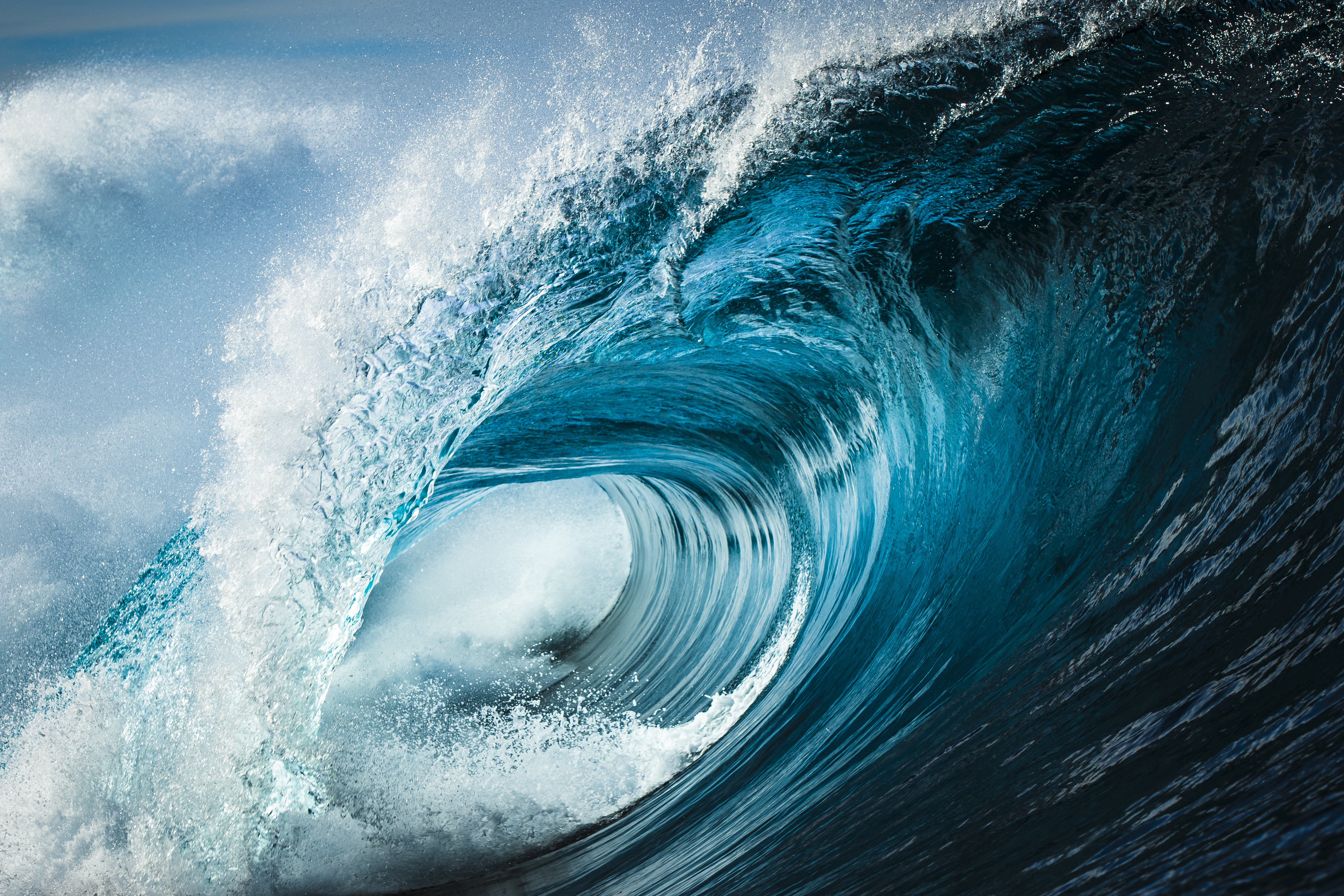 large blue crashing barrel wave 