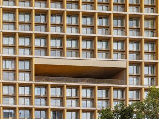 wood up a timber tower in paris by lan, the contemporary wood architecture example's facade gridded facade