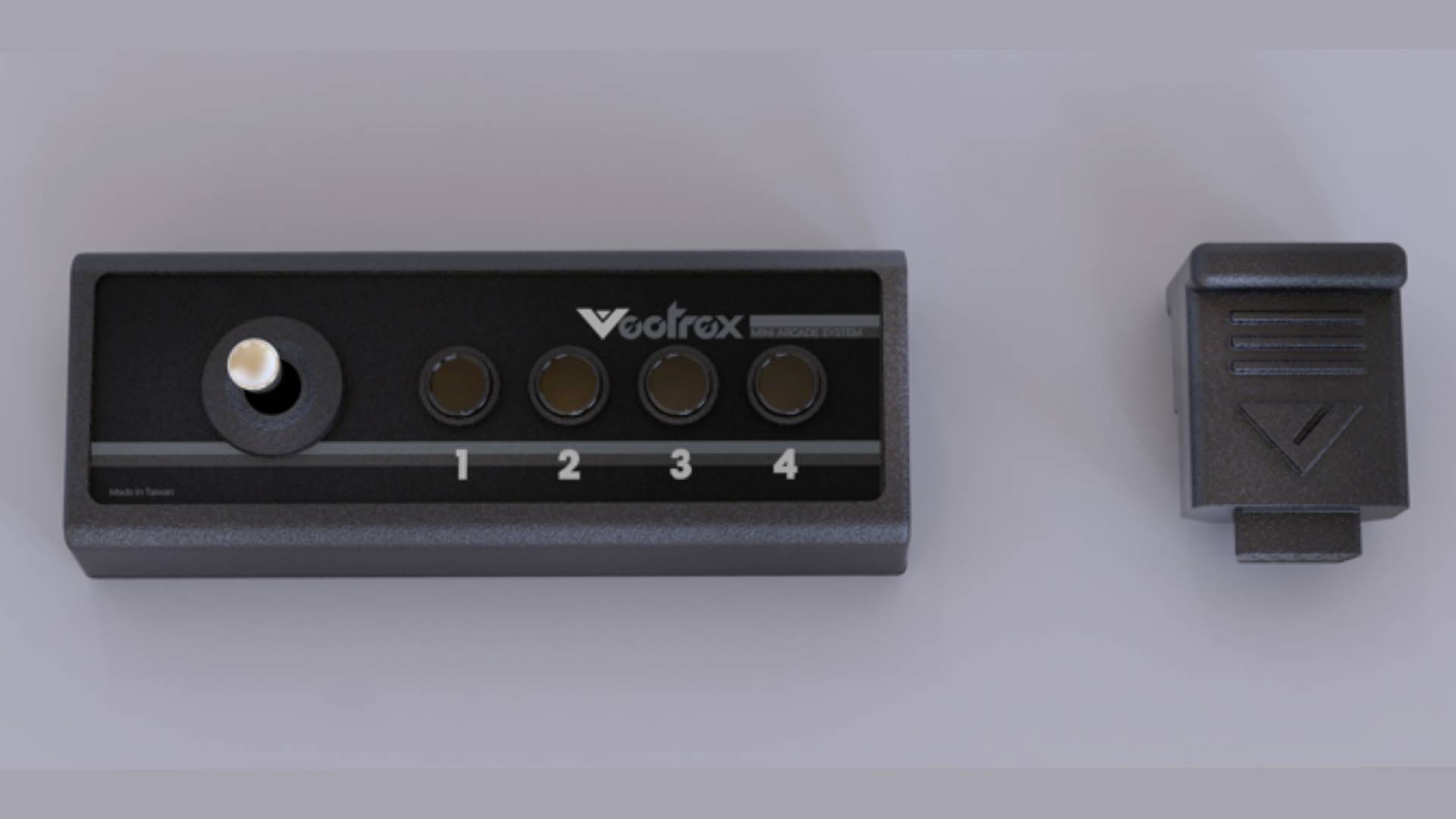 Vectrex Mini controller next to dongle.