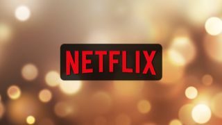 Netflix logo on a gold lights background