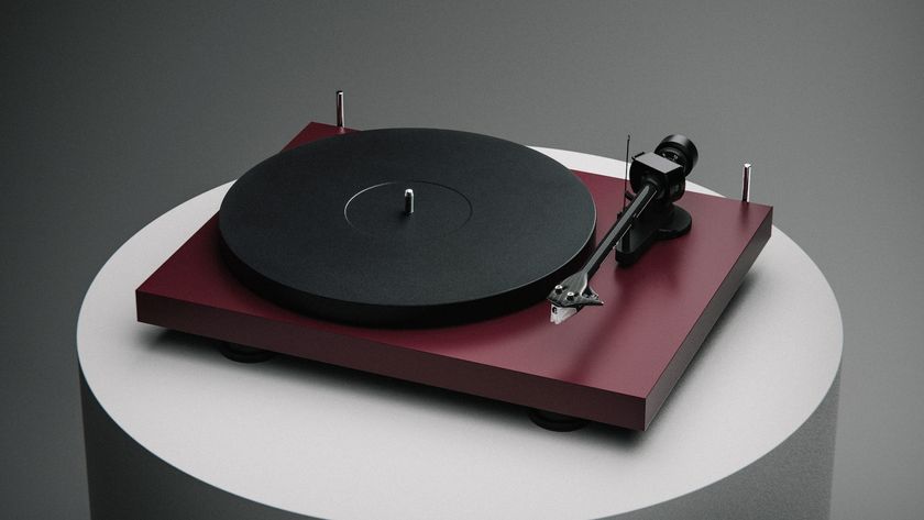 Pro-Ject Debut Evo 2 in wine red satin finish on a plinth