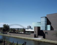 Brindley Arts Centre, Runcorn, United Kingdom, Architect John Miller And Partners, Brindley Arts Centre Day View With Bridgewater Canal And Silver Jubilee Bridge. (Photo by View Pictures/Universal Images Group via Getty Images)