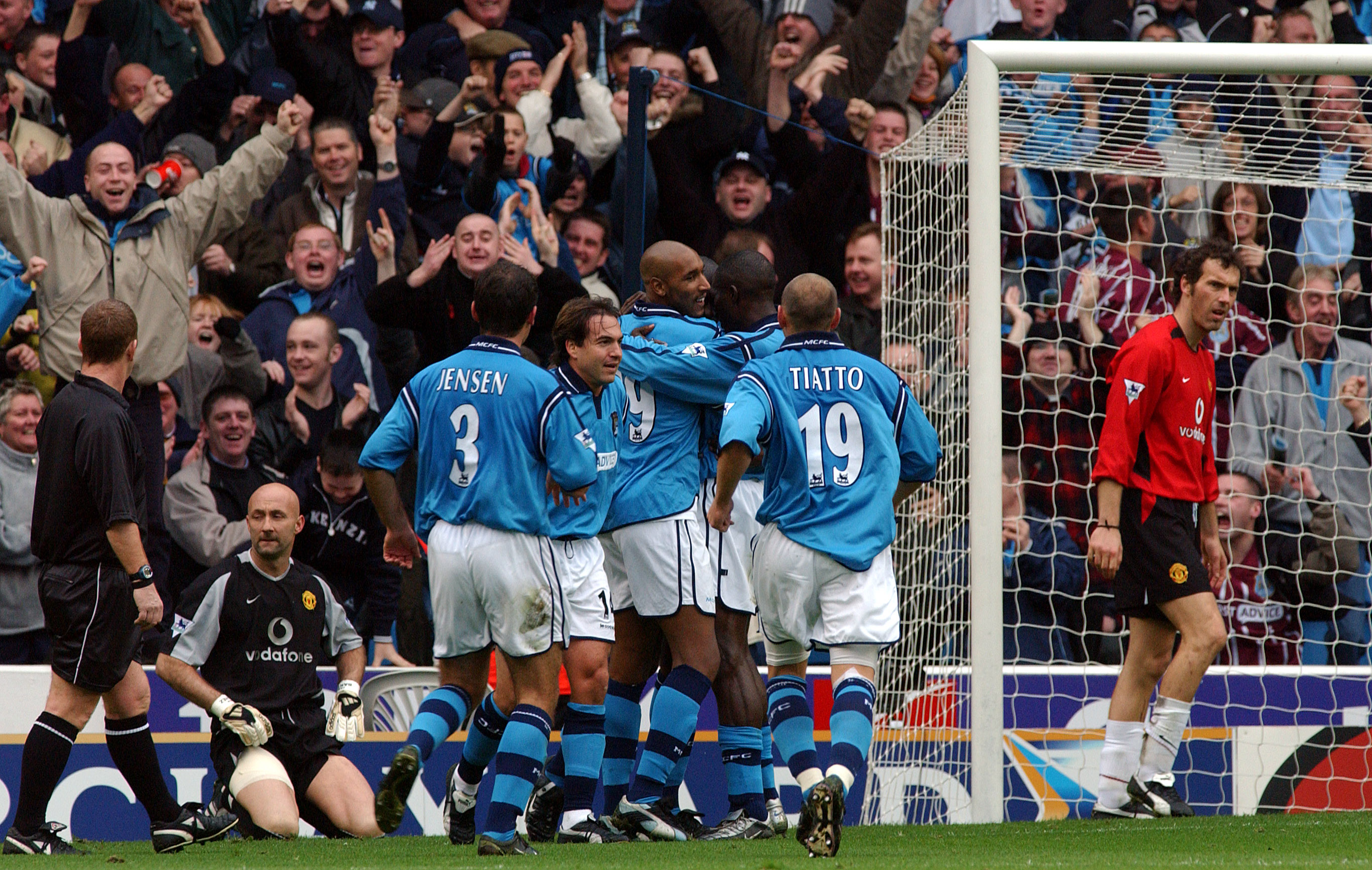 Manchester City players celebrate their second goal against Manchester United in the last ever derby at Maine Road in November 2002.