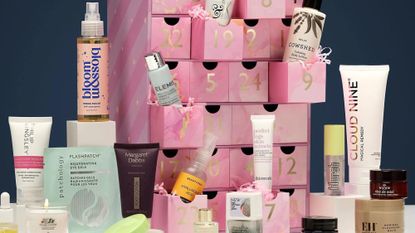 Image shows selection of beauty products spilling out of the Next affordable beauty advent calendar for 2024