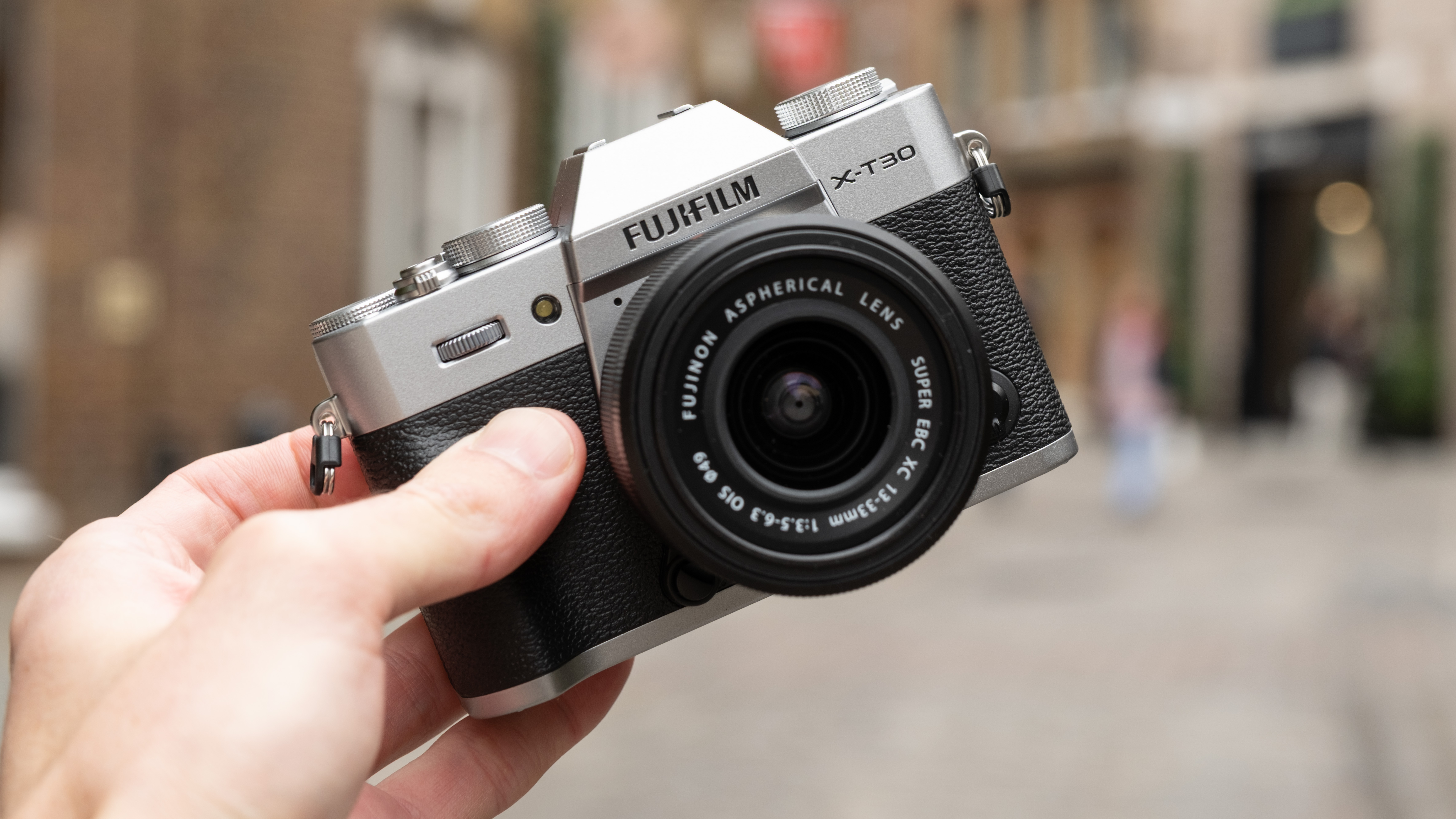 Fujifilm X-T30 III camera held in a hand
