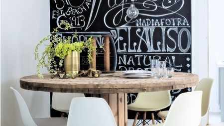 blackboard wall with dining table and chairs