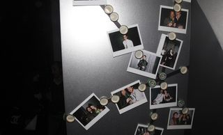 Magnetic strips display photographs of the party guests, taken by the Heineken Club staff