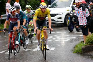 Team Alpecin Fenix Mathieu van der Poel of Netherlands R wearing the overall leaders yellow jersey rides during the 8th stage of the 108th edition of the Tour de France cycling race 150 km between Oyonnax and Le GrandBornand on July 03 2021 Photo by Thomas SAMSON AFP Photo by THOMAS SAMSONAFP via Getty Images