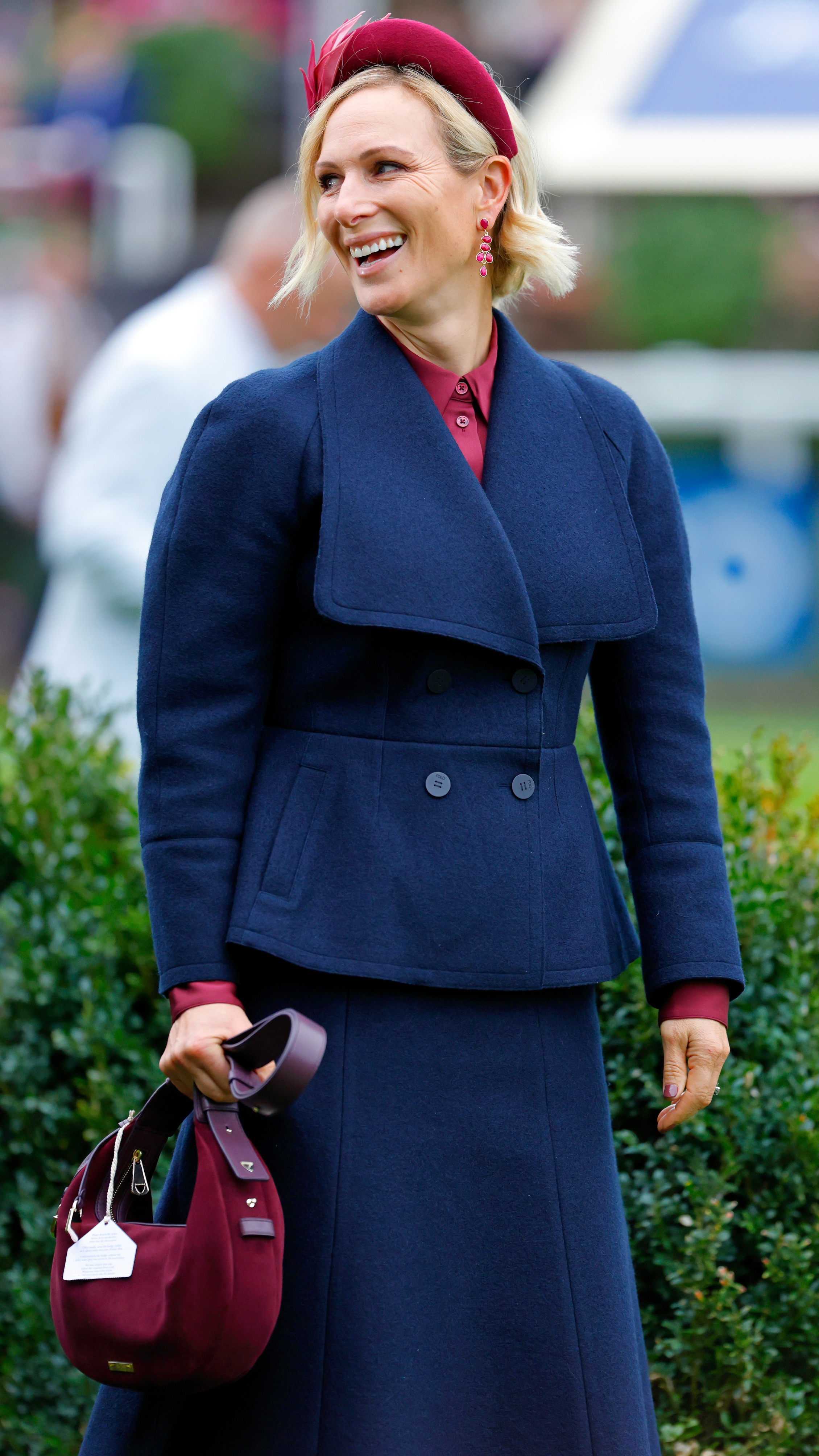 Zara Tindall smiles and holds her handbag as she attends QIPCO British Champions Day at Ascot Racecourse on October 18, 2025