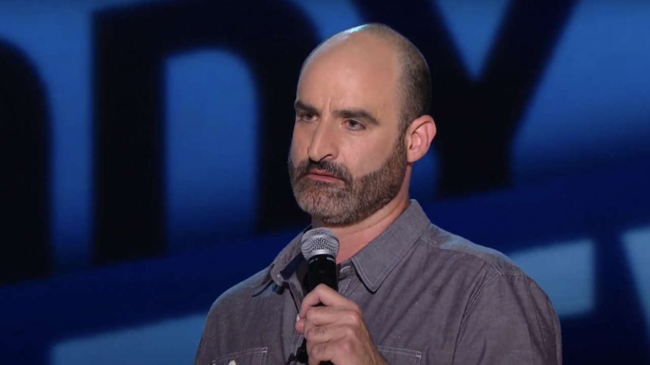 Brody Stevens performing stand-up comedy on The Half Hour