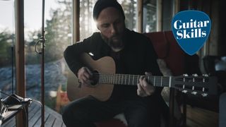 Man playing an acoustic guitar