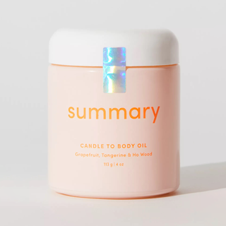 A pastel pink Summary candle that turns into body oil