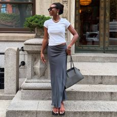 Devin Arielle wears strappy sandals.