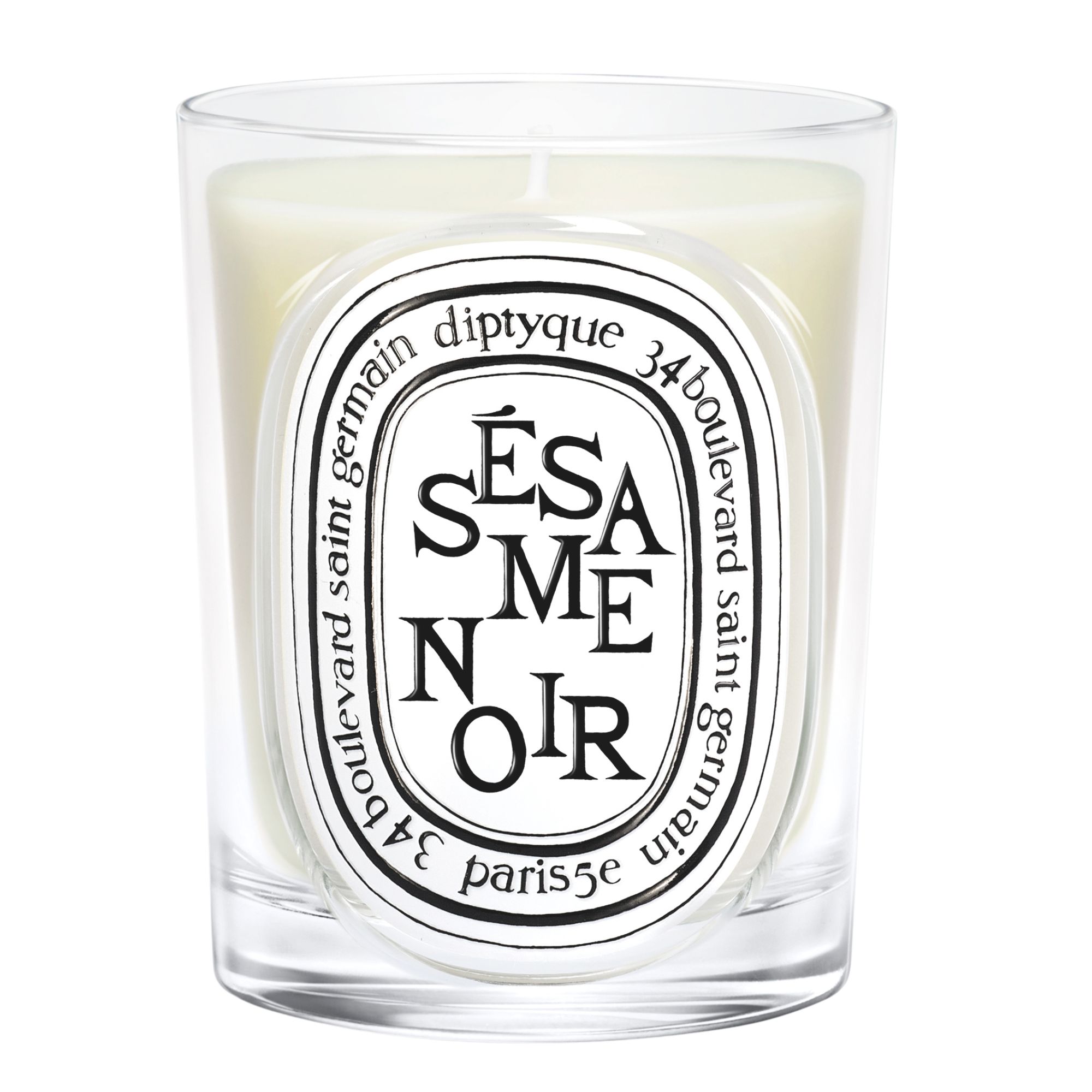 Diptyque Sesame Noir candle in a glass vessel with white wax and white oval label with black lettering