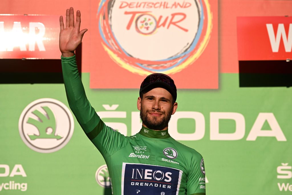 WEIMAR GERMANY AUGUST 24 Filippo Ganna of Italy and Team INEOS Grenadiers celebrates at podium as Green Points Jersey winner during the 37th Deutschland Tour 2022 Prologue a 26km individual time trial from Weimar to Weimar DeineTour on August 24 2022 in Weimar Germany Photo by Stuart FranklinGetty Images