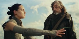 Star Wars: The Last Jedi Rey tries to feel the force, while Luke stands by with a frond