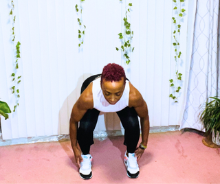 Personal trainer Elethia Gay performs cherry pickers