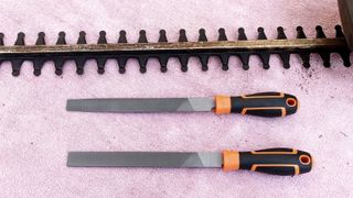 Hedge trimmer blades with sharpening tools